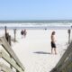 © Reuters. FILE PHOTO: People walk around as beaches reopen after closures aimed at preventing the spread of coronavirus disease (COVID-19) in North Myrtle Beach, South Carolina, U.S., April 21, 2020. REUTERS/Rachel Jessen/File Photo