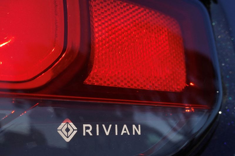 © Reuters. FILE PHOTO: The Rivian name and logo are shown on one of their new electric SUV vehicles in San Diego, U.S., December 16, 2022. REUTERS/Mike Blake/File Photo