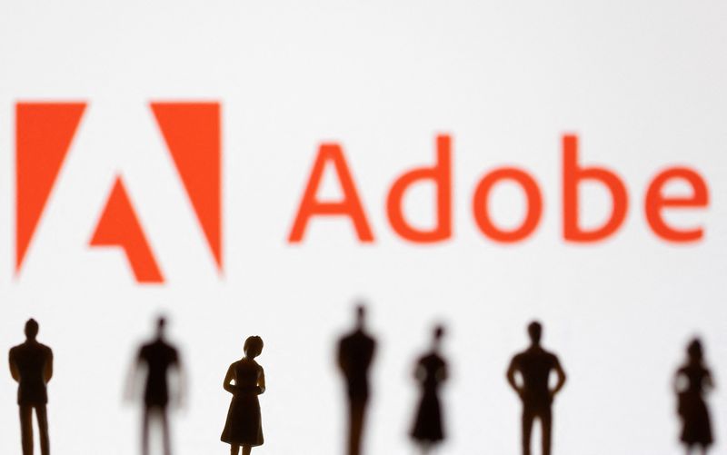 © Reuters. FILE PHOTO: Figurines are seen in front of displayed Adobe logo in this illustration taken June 13, 2022. REUTERS/Dado Ruvic/Illustration/File Photo