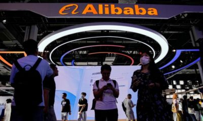 © Reuters. FILE PHOTO: Alibaba Group sign is seen at the World Artificial Intelligence Conference (WAIC) in Shanghai, China July 6, 2023. REUTERS/Aly Song/File photo