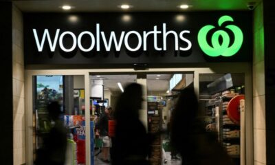 © Reuters. FILE PHOTO: People walk past a Woolworths supermarket in the Sydney Central Business District in Sydney, Australia, May 14, 2024. REUTERS/Jaimi Joy/File Photo