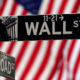 © Reuters. FILE PHOTO: A Wall Street sign is pictured outside the New York Stock Exchange, New York City, U.S., April 16, 2021. REUTERS/Carlo Allegri//File Photo