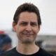 © Reuters. FILE PHOTO: Former diplomat Michael Kovrig reacts following his arrival on a Canadian air force jet after his release from detention in China, at Pearson International Airport in Toronto, Ontario, Canada September 25, 2021. REUTERS/Chris Helgren/File Photo