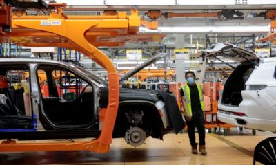 Stellantis assembly workers work on assembling the 2021 Jeep Grand Cherokee L