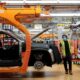 Stellantis assembly workers work on assembling the 2021 Jeep Grand Cherokee L