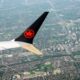 © Reuters. FILE PHOTO: An Air Canada plane is seen in the air after departing from Pearson International Airport in Toronto, Ontario, Canada May 16, 2022.  REUTERS/Carlos Osorio/File Photo