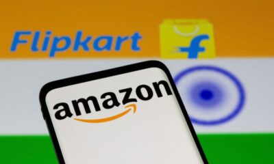 © Reuters. FILE PHOTO: Smartphone with Amazon logo is seen in front of displayed Flipkart logo and Indian flag in this illustration taken, July 30, 2021. REUTERS/Dado Ruvic/Illustration/File Photo