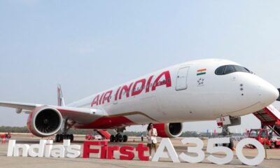 © Reuters. FILE PHOTO: A woman stands next to the Air India Airbus A350 aeroplane, displayed at Wings India 2024 aviation event at Begumpet airport, Hyderabad, India, January 18, 2024. REUTERS/Almaas Masood/File Photo