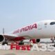 © Reuters. FILE PHOTO: A woman stands next to the Air India Airbus A350 aeroplane, displayed at Wings India 2024 aviation event at Begumpet airport, Hyderabad, India, January 18, 2024. REUTERS/Almaas Masood/File Photo