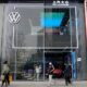 © Reuters. FILE PHOTO: People walk past an ID. Store X showroom of SAIC Volkswagen in Chengdu, Sichuan province, China January 10, 2021. REUTERS/Yilei Sun/File Photo