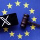 © Reuters. FILE PHOTO: X logo, EU flag and Judge gavel are seen in this illustration taken, August 6, 2024. REUTERS/Dado Ruvic/Illustration/File Photo