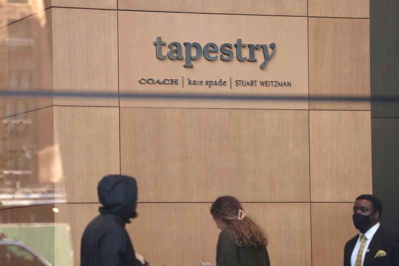 © Reuters. FILE PHOTO: A signage is seen in the offices of Tapestry, Inc., in Manhattan, New York, U.S., November 19, 2021. REUTERS/Andrew Kelly/File Photo